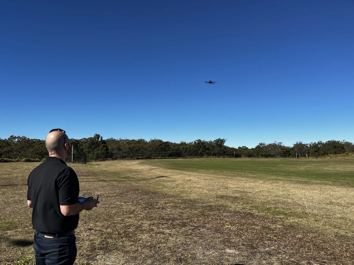 An operator flying ScanLift Orbit during a University of Tasmania field visit