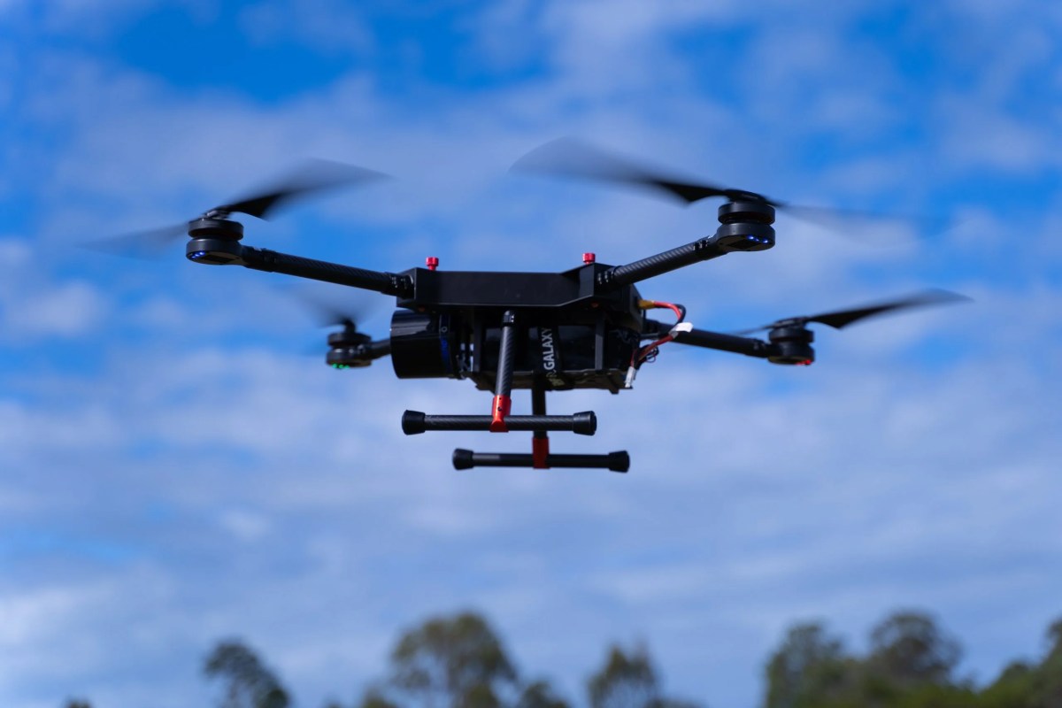Close up image of Evolution Flight's ScanLift Mini UAV flying.