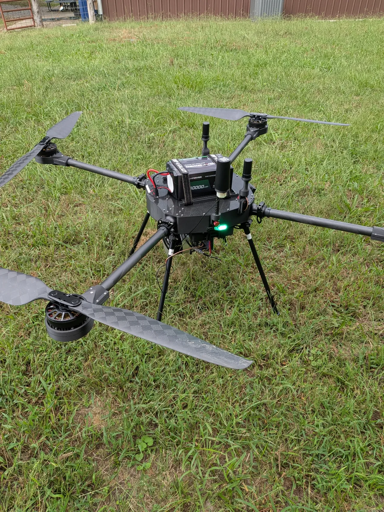 Patriot quadcopter on grass with its battery and landing gear fitted
